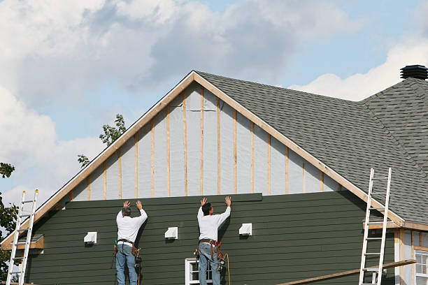 Professional Storm Damage Siding Repair technician working in Farmington, MN
